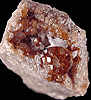 Mineral specimen: Essonite Garnet from Road cut west of train station, West Redding, Connecticut.