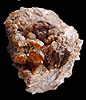 Mineral specimen: Essonite Garnet from Road cut west of train station, West Redding, Connecticut.